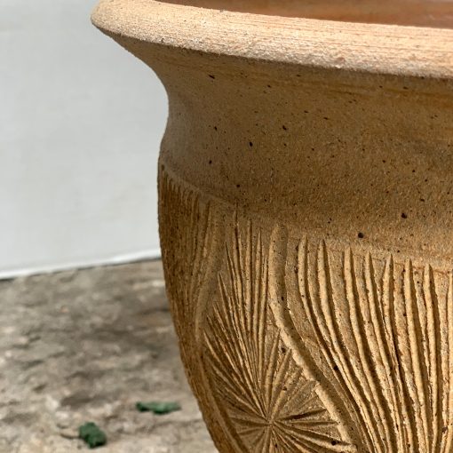 Earthgender midcentury pottery, closeup of sunburst design on teardrop planter