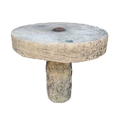Reclaimed limestone table top made from antique millstone
